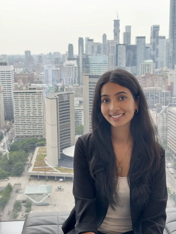 Khushi with the downtown Toronto skyline behind her